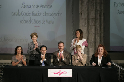 Mrs. Laura Bush applauds following the signing of the U.S.-Mexico Partnership for Breast Cancer Awareness and Research agreement between the Susan G. Komen for the Cure, MD Anderson Cancer Center, U.S. State Department, the Instituto Nacional de Cancerologia and Mexican Association Against Breast Cancer (Fundacion Cim*ab) Friday, March 14, 2008, at the Interactive Economics Museum in Mexico City. From left are Bertha Aguilar, Dr. Alejandro Mohar, U.S Ambassador to Mexico Antonio O. Garza, Jr., Hala Moddelmog, Margarita Zavala (standing), and Dr. Kendra Woods. White House photo by Shealah Craighead