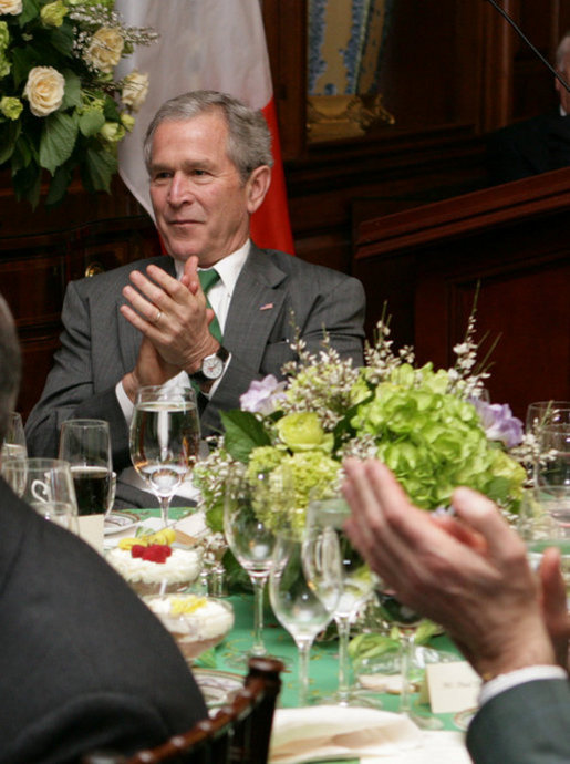President George W. Bush applauds the music entertainment at the Speaker of the House's annual St. Patrick's Day luncheon Monday, March 17, 2008 at the U.S. Capitol in Washington, D.C. White House photo by Chris Greenberg
