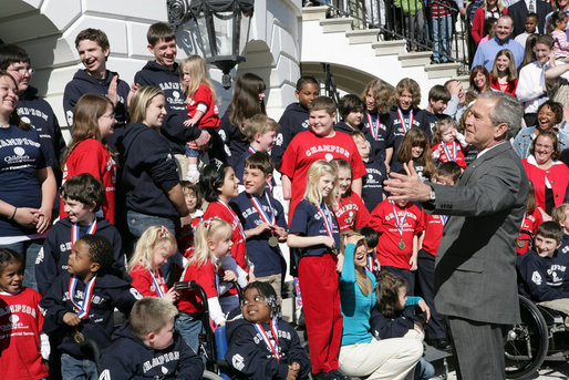 President George W. Bush gestures as he welcomes children and their parents from the Children's Miracle Network Champion Children to the White House Monday, March 17, 2008. White House photo by Chris Greenberg