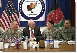 Vice President Dick Cheney shares a light moment with 19-year-old Silver Star Medal recipient U.S. Army Specialist Monica Brown, center right, during a dinner with U.S. troops Thursday, March 20, 2008 at Bagram Air Base, Afghanistan. Joining the Vice President and Spc. Brown are from left: TSgt. Vernon Jones; Army Commendation Medal for Valor recipient Spc. Charles Bell; and Spc. Brown's brother, infantryman Justin Brown. White House photo by David Bohrer