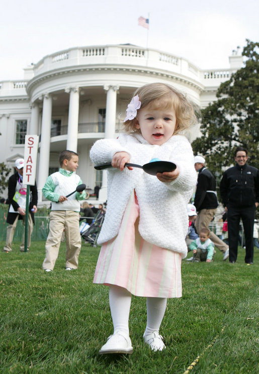 A young child carefully balances her Easter Egg on a spoon Monday, March 24, 2008 on the South Lawn of the White House, during the 2008 White House Easter Egg Roll. White House photo by Joyce N. Boghosian