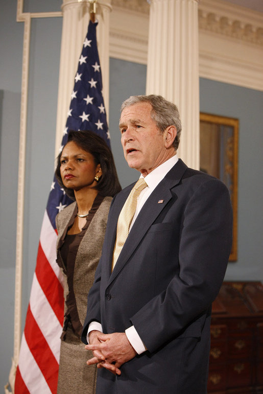 President George W. Bush stands with U.S. Secretary of State Condoleezza Rice as he talks with reporters Monday, March 24, 2008, following a briefing at the U.S. Department of State in Washington, D.C. White House photo by Eric Draper