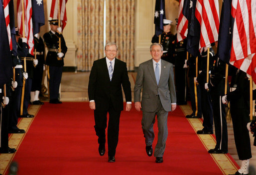 President George W. Bush and Australian Prime Minister Kevin Rudd walk together through Cross Hall to the East Room of the White House Friday, March 28, 2008, for their joint press availability. White House photo by Joyce N. Boghosian