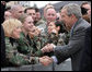 President George W. Bush shakes hands with troops following his event in Freehold, New Jersey Friday, March 28, 2008, at McGuire Air Force Base in New Jersey. White House photo by Chris Greenberg