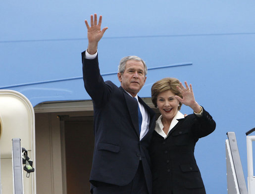 President George W. Bush and Mrs. Laura Bush wave upon their Romanian arrival Tuesday, April 1, 2008, at Henri Coanda International Airport in Bucharest, site of the 2008 NATO Summit. White House photo by Eric Draper