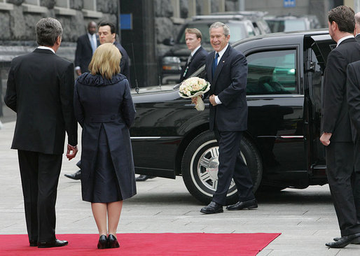 President George W. Bush carries a bouquet of flowers on his arrival to meet President Viktor Yushchenko of Ukraine, and his wife, Mrs. Kateryna Yushchenko Tuesday, April 1, 2008, at the Presidential Secretariat in Kyiv for their welcoming ceremony. White House photo by Chris Greenberg