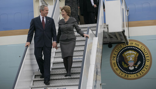 President George W. Bush and Mrs. Laura Bush steal a moment as they deplane Air Force One Wednesday, April 2, 2008, upon their return to Bucharest from the Romanian presidential retreat in Neptun, Romania. White House photo by Shealah Craighead