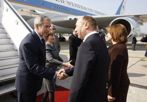 President George W. Bush and Mrs. Laura Bush are greeted upon arrival Wednesday, April 2, 2008, by President Traian Basescu of Romania and Mrs. Maria Basescu at Mihail Kogalniceanu Airport in Constanta, Romania. White House photo by Eric Draper