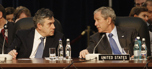 President George W. Bush and Prime Minister Gordon Brown of the United Kingdom, speak together at the start of the day’s session Thursday, April 3, 2008, at the 2008 NATO Summit in Bucharest. White House photo by Eric Draper