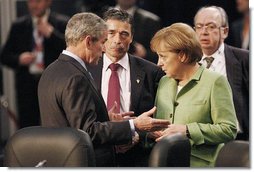 President George W. Bush joins Danish Prime Minister Anders Fogh Ransmussen and German Chancellor Angela Merkel Thursday, April 3, 2008, prior to the start of the afternoon's NATO Summit Meeting on Afghanistan in Bucharest. White House photo by Eric Draper