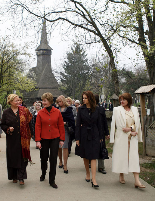 Mrs. Laura Bush walks with the spouses of NATO leaders Thursday, April 3, 2008, at the open-aired Dimitrie Gusti Village Museum in Bucharest. With her are Maria Basescu, right, spouse of Romania’s President Traian Basescu, and Alexandra Coman, fiancé of Romania’s Foreign Minister Adrian Cioroianu. White House photo by Shealah Craighead