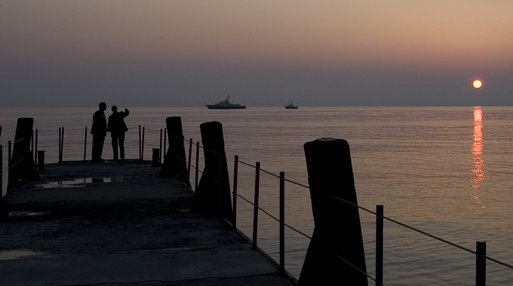 President George W. Bush and Russia's President Vladimir Putin share a quiet moment on a pier overlooking the Black Sea Saturday, April 5, 2008, at President Putin's summer retreat, Bocharov Ruchey, in Sochi, Russia. White House photo by Eric Draper