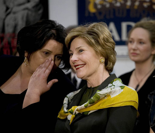 Mrs. Laura Bush watches the Lado National Folk Dance Ensemble performance, Saturday, April 5, 2008 in Zagreb, as the wife of Prime Minister Sanader translates the performance lyrics for her. White House photo by Shealah Craighead 
