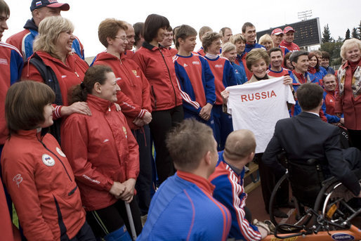 Mrs. Laura Bush holds a T-shirt presented to her Sunday, April 6, 2008, by members of the Russian Paralympic team at Central Sochi Stadium in Sochi, Russia. White House photo by Shealah Craighead