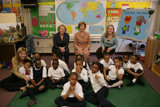 Mrs. Laura Bush, her daughter Jenna Bush, left, and U.S. Education Secretary Margaret Spellings pose for a photo with the first grade students of teacher Laura Gilbertson, right, Monday, April 14, 2008, at the Martin Luther King Elementary School in Washington, D.C., to mark the tenth anniversary of Teach for America Week. White House photo by Shealah Craighead