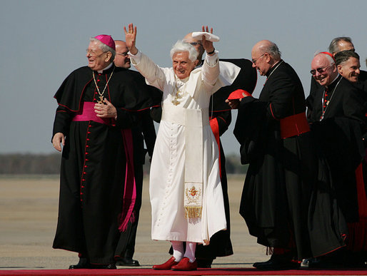 Pope Benedict XVI acknowledges the cheers of the crowd on his arrival to Andrews Air Force Base, Md., Tuesday, April 15, 2008, where he was greeted by President George W. Bush, Laura Bush and their daughter, Jenna. White House photo by Shealah Craighead