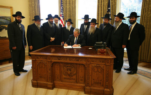 With Chabad rabbis from across the world looking on, President George W. Bush signs a presidential proclamation Tuesday, April 15, 2008, in honor of Wednesday's Education and Sharing Day, and highlighting the important work of the Chabad Lubavitch movement. The Chabad Lubavitch movement promotes global education, and since 1978, every President has signed an Education and Sharing Day proclamation. White House photo by Joyce N. Boghosian
