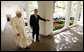 President George W. Bush escorts Pope Benedict XVI along the White House Colonnade for their meeting in the Oval Office Wednesday, April 16, 2008, following the Pope's welcoming ceremony on the South Lawn of the White House. White House photo by Eric Draper