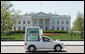 Pope Benedict XVI waves from the Pope-mobile as he passes the White House on Pennsylvania Avenue Wednesday, April 16, 2008, following a welcoming ceremony in his honor on the South Lawn. White House photo by Chris Greenberg