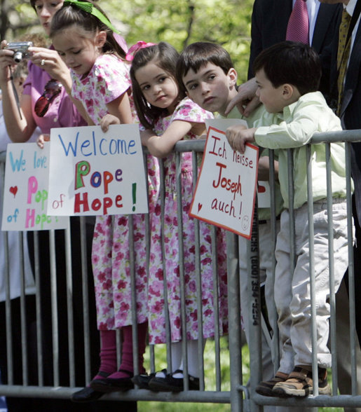 Kids with signs wait for Pope Benedict XVI outside of the United States Treasury Department Wednesday, April 16, 2008, after after the arrival ceremony at the White House. White House photo by Patrick Tierney