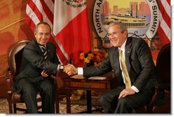President George W. Bush and Mexico’s President Felipe Calderon shake hands in their first meeting to discuss issues Monday, April 21, 2008, during the 2008 North American Leaders’ Summit in New Orleans.  White House photo by Chris Greenberg