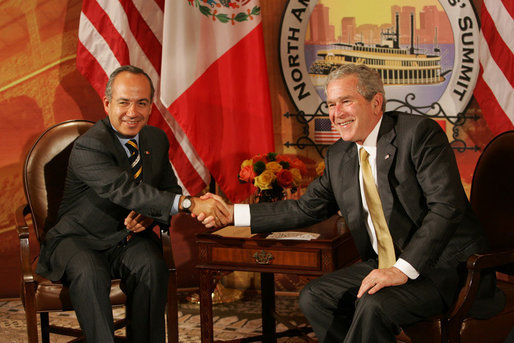 President George W. Bush and Mexico’s President Felipe Calderon shake hands in their first meeting to discuss issues Monday, April 21, 2008, during the 2008 North American Leaders’ Summit in New Orleans. White House photo by Chris Greenberg