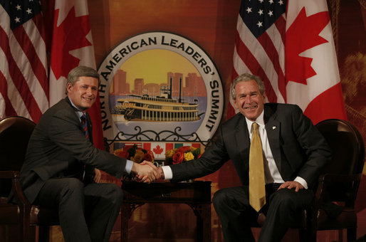 President George W. Bush and Canadian Prime Minister Stephen Harper shake hands in their first meeting to discuss issues Monday, April 21, 2008, during the 2008 North American Leaders' Summit in New Orleans. White House photo by Joyce N. Boghosian