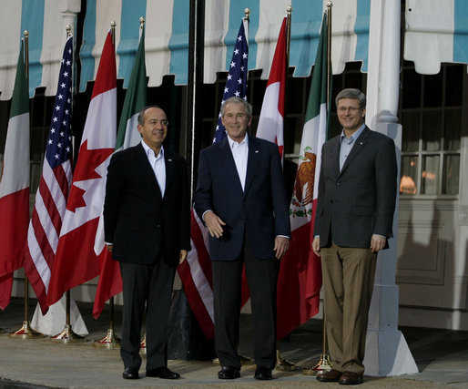 President George W. Bush joins Mexico’s President Felipe Calderon and Canadian Prime Minister Stephen Harper as they pose for photographers outside the Commander’s Palace restaurant Monday evening, April 21, 2008, before attending the North American Leaders’ Summit dinner in New Orleans. White House photo by Joyce N. Boghosian