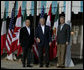 President George W. Bush joins Mexico’s President Felipe Calderon and Canadian Prime Minister Stephen Harper as they pose for photographers outside the Commander’s Palace restaurant Monday evening, April 21, 2008, before attending the North American Leaders’ Summit dinner in New Orleans. White House photo by Joyce N. Boghosian