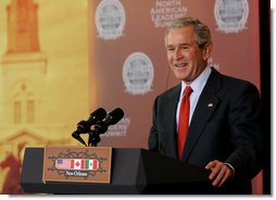 President George W. Bush smiles in response to a reporter's question at a joint news conference Tuesday, April 22, 2008, with Mexico's President Felipe Calderon and Canada’s Prime Minster Stephen Harper on the last day of the 2008 North American Leaders' Summit in New Orleans. White House photo by Chris Greenberg