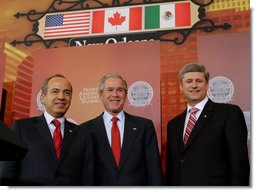 President George W. Bush, Mexico's President Felipe Calderon and Canadian Prime Minster Stephen Harper stand together at the conclusion of their joint news conference Tuesday, April 22, 2008, the last day of the 2008 North American Leaders' Summit in New Orleans. White House photo by Joyce N. Boghosian