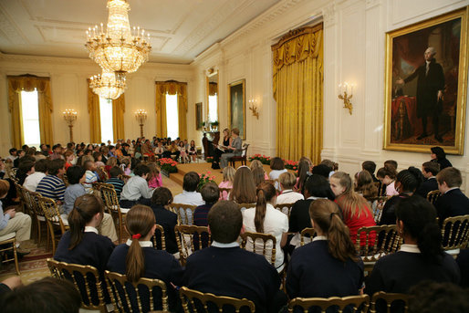 Mrs. Laura Bush and daughter, Jenna Bush, read a book to children of White House staff at Bring Your Child to Work Day Thursday, April 24, 2008, in the East Room of the White House. White House photo by Shealah Craighead