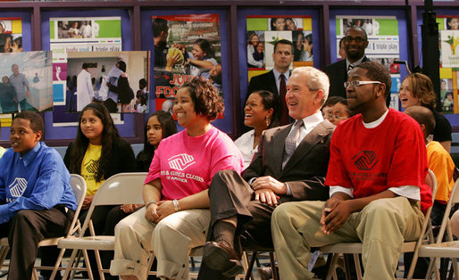 President George W. Bush joins members at the Northwest Boys & Girls Club in Hartford, Conn., Friday, April 25, 2008, during a program presentation for Malaria Awareness Day. President Bush later reviewed projects that the Boys & Girls Club members made about the prevention and treatment of malaria. White House photo by Chris Greenberg