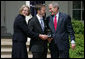 President George W. Bush smiles as he and Secretary of Education Margaret Spellings present Mike Geisen with the 2008 National Teacher of the Year honors Wednesday, April 30, 2008, in the Rose Garden of the White House. White House photo by Shealah Craighead