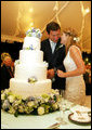Henry and Jenna Hager pause as they cut their wedding cake Saturday, May 10, 2008, during a reception in their honor following the ceremony at Prairie Chapel Ranch near Crawford, Texas. White House photo by Shealah Craighead