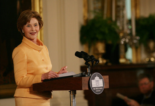 Mrs. Laura Bush welcomes guests to the East Room of the White House Monday, May 12, 2008, as she congratulates the recipients of the 2008 Preserve America Presidential Awards. The African Burial Ground Project, The Corinth and Alcorn County Mississippi Heritage Tourism Initiative, the Lower East Side Tenement Museum and the Texas Historic Courthouse Preservation Program were all honored for their efforts in preserving our national historic sites. White House photo by Allison Huff