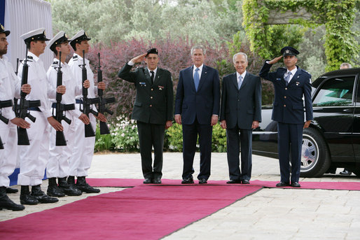President George W. Bush and Israel’s President Shimon Peres stand on the red carpet before walking through an honor guard Wednesday, May 14, 2008, at the President’s Residence in Jerusalem. The two leaders met shortly after the late morning arrival by President Bush and Mrs. Laura Bush. White House photo by Chris Greenberg