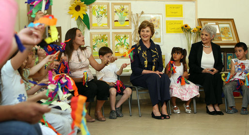 Mrs. Laura Bush joins students at Hand in Hand School for Jewish-Arab Education Wednesday, May 14, 2008, during her visit to Jerusalem. Joining her on the tour of the school that provides integrated, bilingual education to Jewish and Arab students in Israel is Mrs. Aliza Olmert, spouse of Israeli Prime Minister Ehud Olmert. White House photo by Shealah Craighead