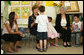 Mrs. Laura Bush shares a moment with a kindergarten student Wednesday, May 14, 2008, at the Hand in Hand School for Jewish-Arab Education in Jerusalem. Mrs. Bush took the opportunity to visit the school with Mrs. Aliza Olmert, right, spouse of Israeli Prime Minister Ehud Olmert. White House photo by Shealah Craighead
