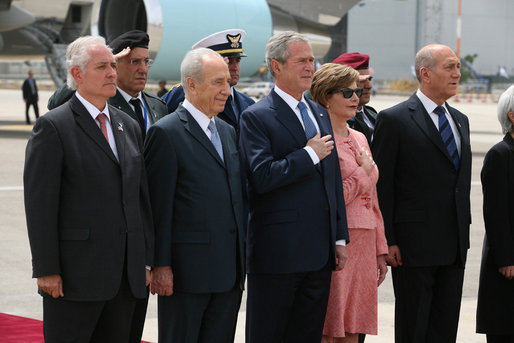 President George W. Bush and Mrs. Laura Bush are joined by Israel’s Ambassador Yitzhak Eldan, left, President Shimon Peres, and Prime Minister Ehud Olmert during the playing of the national anthems Wednesday, May 14, 2008, during arrival ceremonies in honor of President and Mrs. Bush at Ben Gurion International Airport in Tel Aviv. White House photo by Joyce N. Boghosian