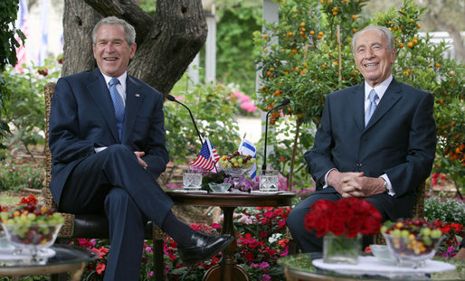 President George W. Bush and President Shimon Peres of Israel smile for photographers Wednesday, May 14, 2008, during their meeting at President Peres’ Jerusalem residence. White House photo by Joyce N. Boghosian