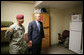 President George W. Bush is given a tour of a 82nd Airborne Division barracks room by 1st Sgt. David Santos, during the President's visit Thursday, May 22, 2008 in Fort Bragg, N.C., for the 82nd Airborne Division review. White House photo by Chris Greenberg