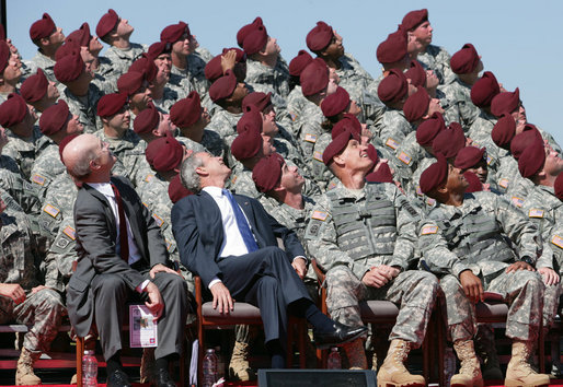 President George W. Bush and U.S. Army Secretary Pete Geren watch members of the U.S. Army's 82nd AIrborne Division parachute onto the field during the President's visit Thursday, May 22, 2008 to Fort Bragg, N.C., for the 82nd Airborne Division Review. White House photo by Chris Greenberg