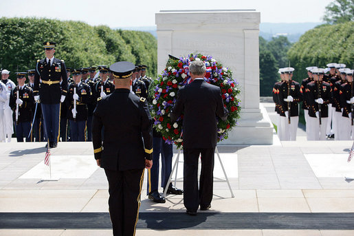 President George W. Bush, accompanied by Major General Richard J. Rowe Jr., commander of the Military District of Washington, foreground left, lays a wreath at the Tomb of the Unknowns Monday, May 26, 2008, during a Memorial Day ceremony at Arlington National Cemetery in Arlington, VA. White House photo by Shealah Craighead