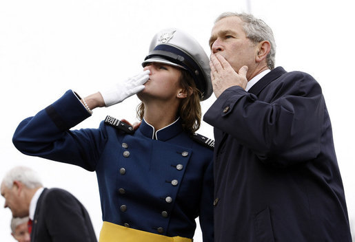 President George W. Bush shares in blowing a kiss to family and friends of a Class of 2008 graduate of the United States Air Force Academy Wednesday, May 28, 2008, during commencement ceremonies in Colorado Springs. Out of the 1, 012 cadets to graduate, 18 percent are women. White House photo by Eric Draper