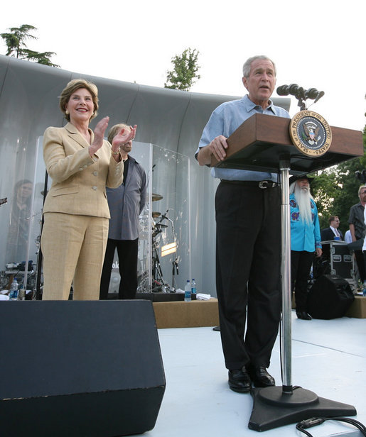 President George W. Bush and Laura Bush are seen on stage as they welcome guests to the annual Congressional Picnic on the South Lawn of the White House, Thursday evening, June 5, 2008, hosted for members of Congress and their families. White House photo by Shealah Craighead