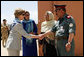 Governor Habiba Sarabi, center, introduces Mrs. Laura Bush to Col. Hafizullah Paymon, Commander of the Afghan Regional Training Center, during a visit to the Police Training Academy in Bamiyan, Afghanistan there Sunday, June 8, 2008. White House photo by Shealah Craighead