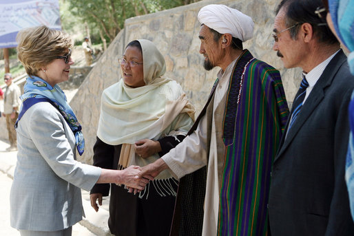 Mrs. Laura Bush meets with local leaders as she arrives June 9, 2008 at the Bamiyan Bazaar in Afghanistan to inaugurate work on the road project. White House photo by Shealah Craighead