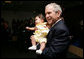 President George W. Bush smiles as he holds a baby during his visit to the United States Embassy Tuesday, June 10, 2008, in Kranj, Slovenia. White House photo by Chris Greenberg