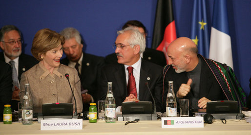 Mrs. Laura Bush, seated next to Afghanistan Foreign Minister Dr. Rangin Dadfar Spanta, speaks with Afghanistan President Hamid Karzai, right, during the International Conference in Support of Afghanistan Thursday, June 12, 2008, in Paris. White House photo by Shealah Craighead